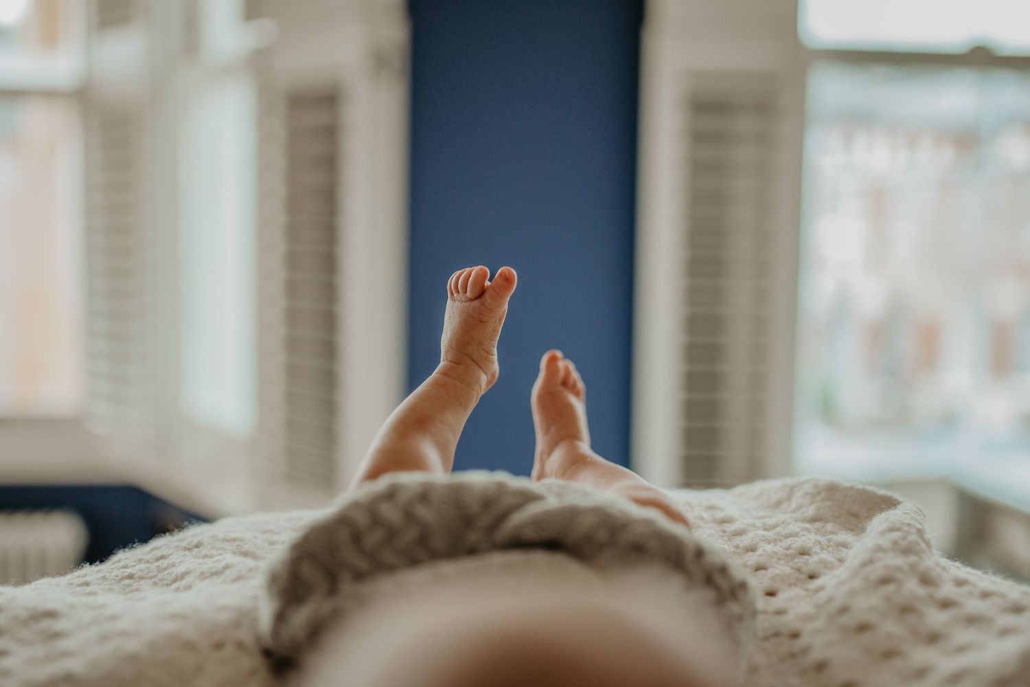 Newborn baby’s tiny fingers captured during a lifestyle session at home in Bromley
