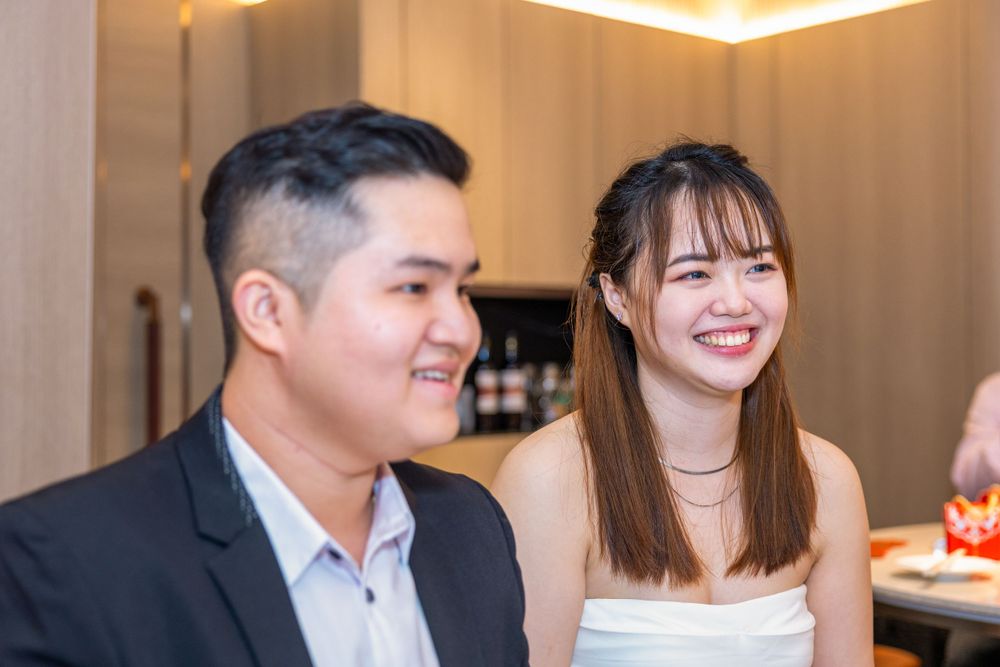 Happy couple sharing a joyful moment during their wedding celebration.