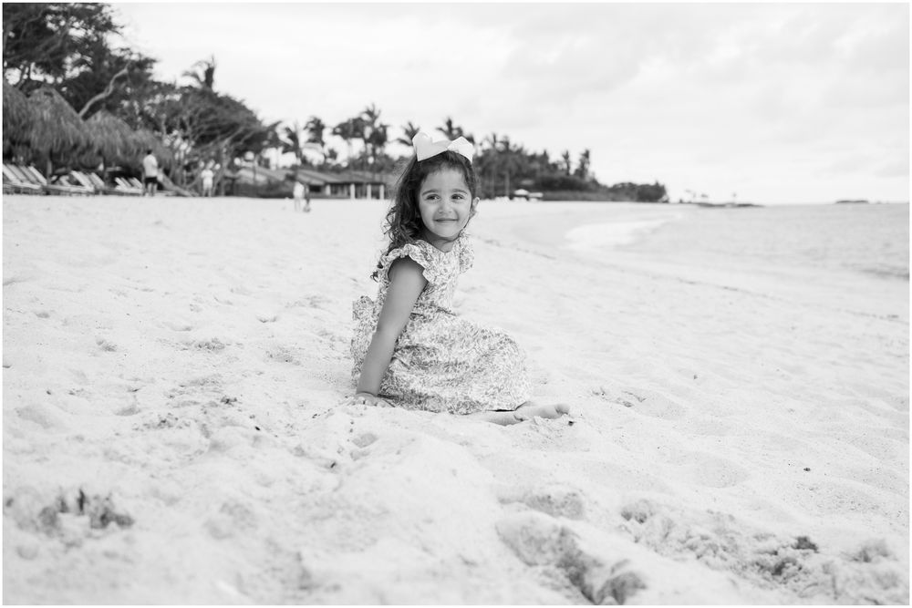 Four Seasons Punta Mita family photography session, joyful moments captured on a white sandy beach with turquoise waters.