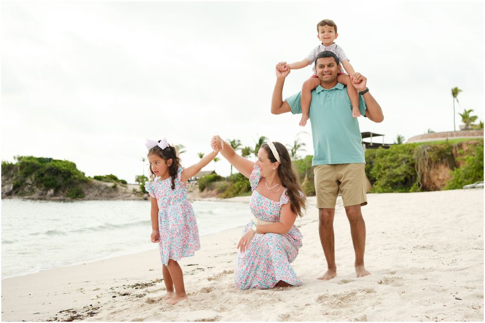 Four Seasons Punta Mita family photography session, family strolling along a white sand beach at sunset in casual beachwear.