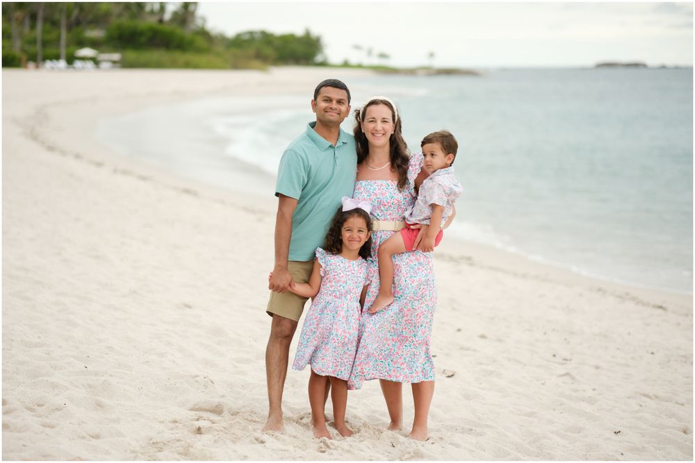 Punta Mita family photography session, family posing on a sun-drenched tropical beach during natural coastal light.
