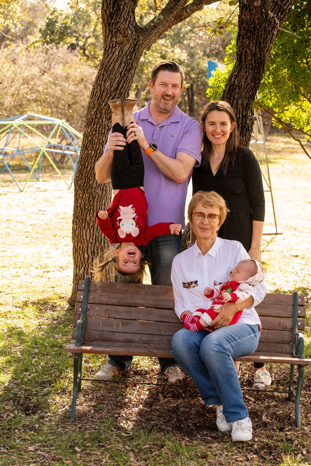 A series of outdoor family photos captured on a wooden bench under trees in a natural warm-lit setting.