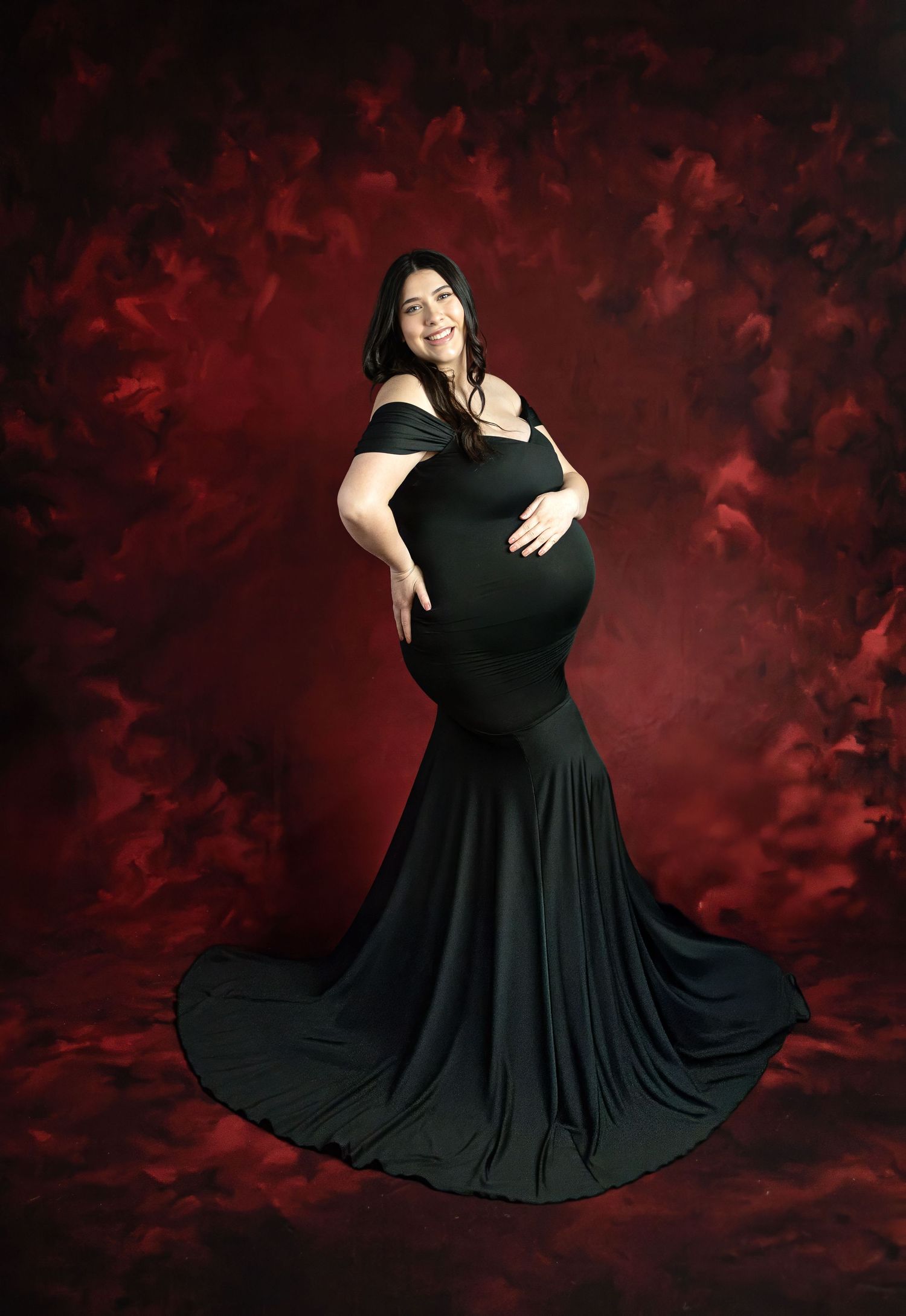 A sequence of studio maternity photos showing a woman in a flowing black gown against a white backdrop.