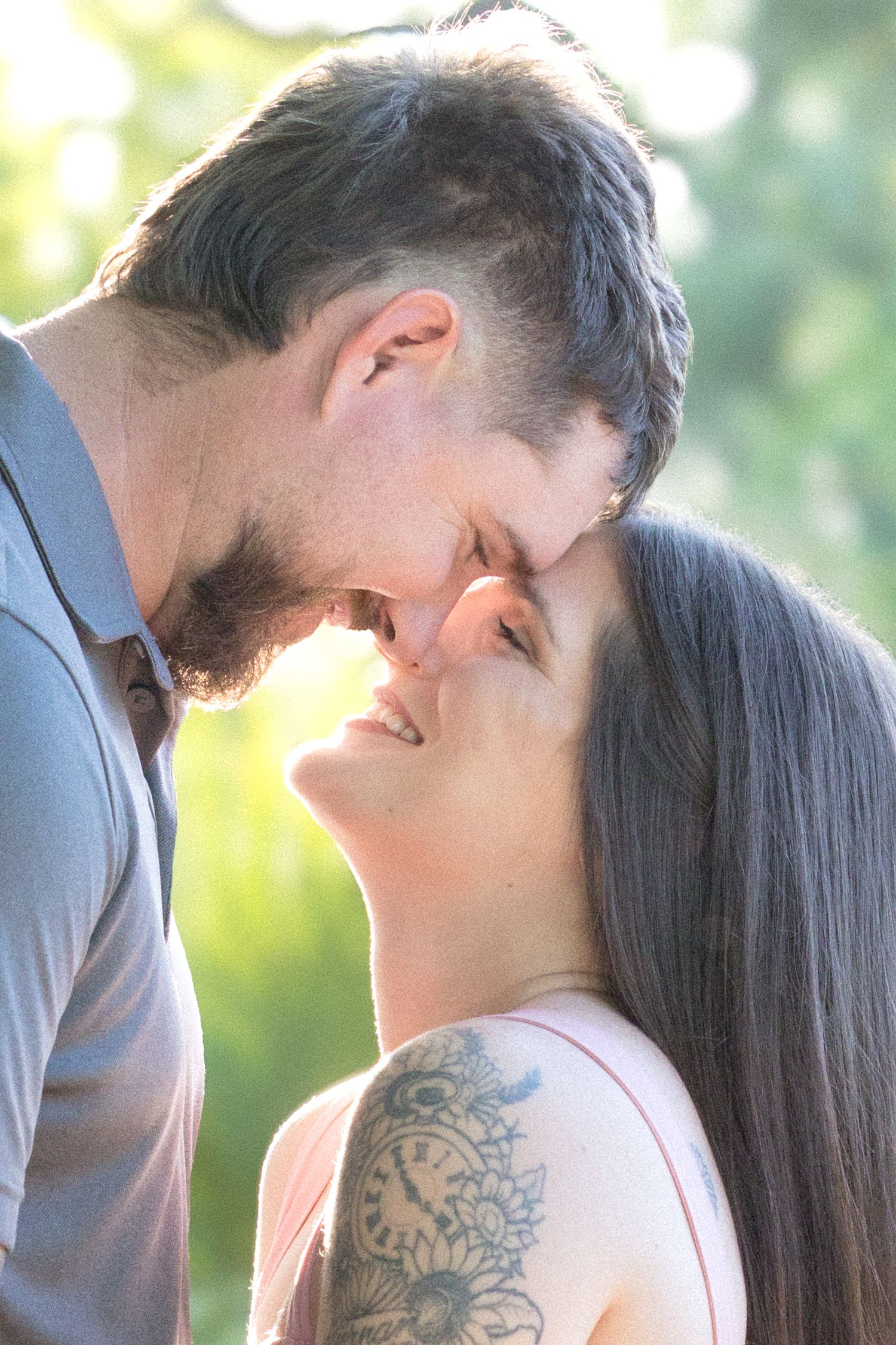Romantic outdoor photo sequence capturing an intimate moment in soft natural lighting.