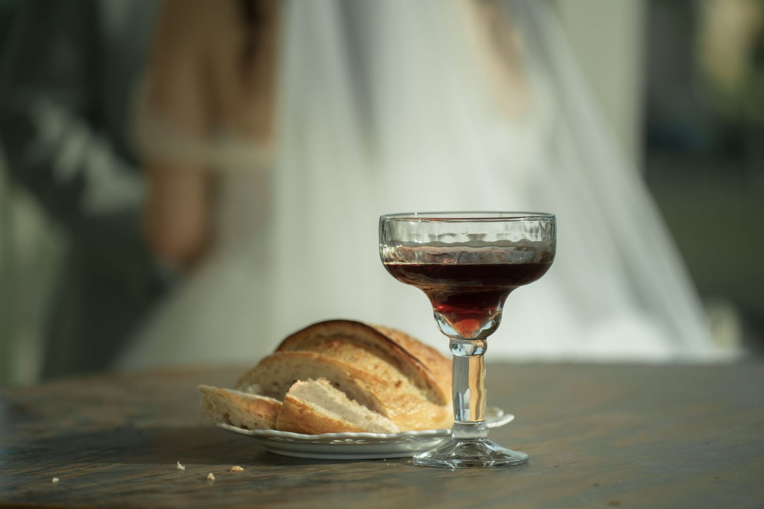 Wedding reception details with wine glasses and table settings.