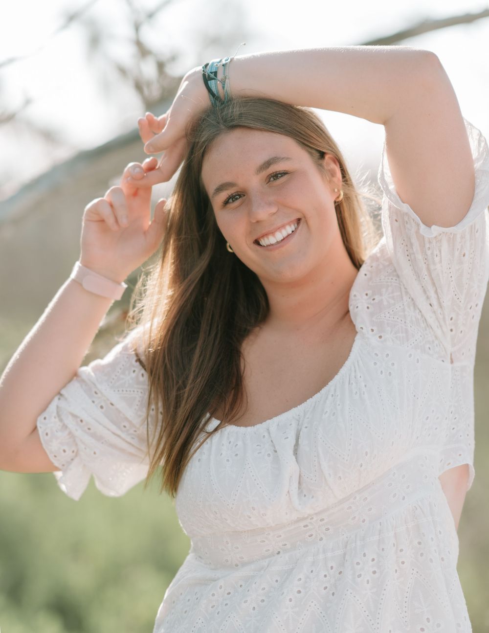 Senior portrait at Driftwood Beach, Jekyll Island GA, featuring natural coastal backdrop and Golden Isles photographer Lindy Rebro Photograp