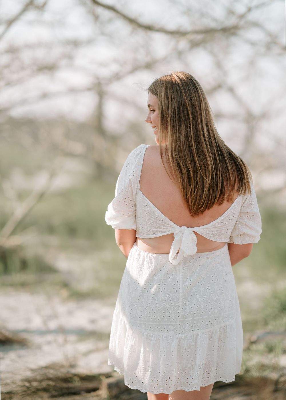 Senior photo session on Jekyll Island with ocean waves, driftwood, and warm Golden Isles sunset lighting by Lindy Rebro Photography.
