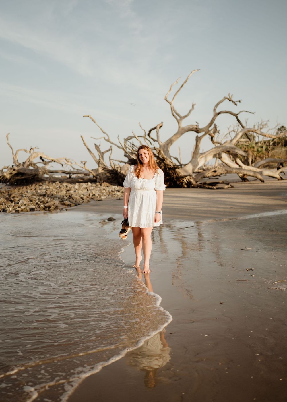 Jekyll Island senior session with natural driftwood scenery and ocean backdrop, Golden Isles senior photographer.