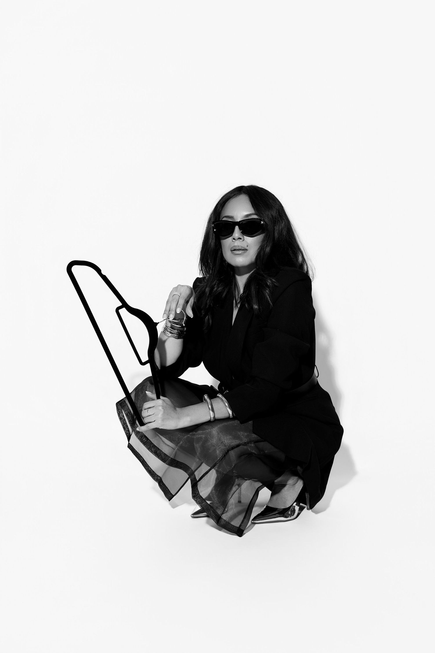Series of lifestyle fashion shots featuring sunglasses and dark clothing against white background.