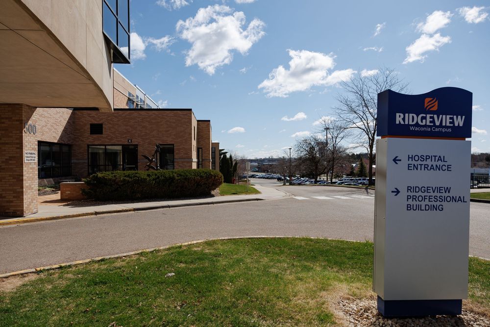 Exterior view of Ridgeview hospital building with signage and blue sky.