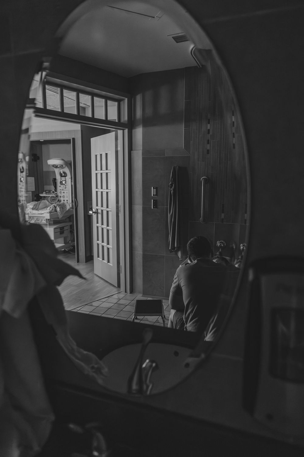 Dark interior views of a van showing sliding door and passenger area in black and white photography.