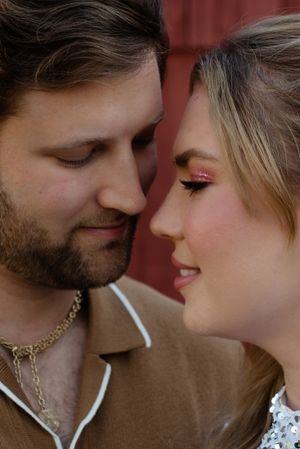Close-up intimate portrait with soft lighting and romantic makeup details.