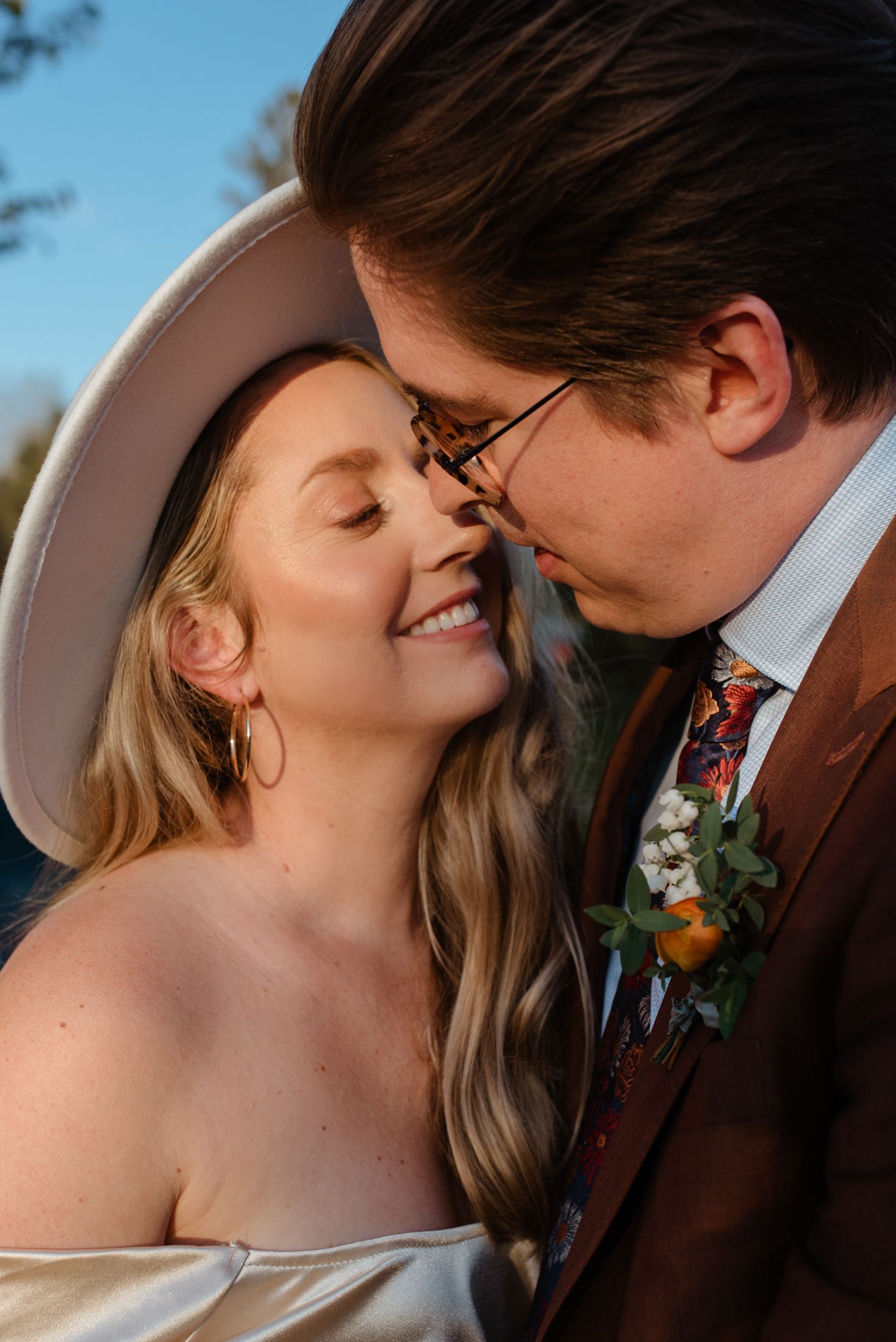 Intimate romantic moment captured during golden hour wedding photoshoot.