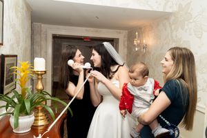 Candid bridal portrait with bride on the phone