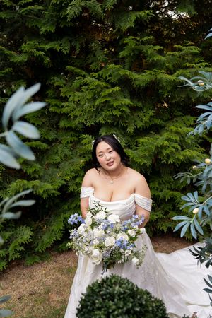 Editorial Image of asian bride with trees behind her