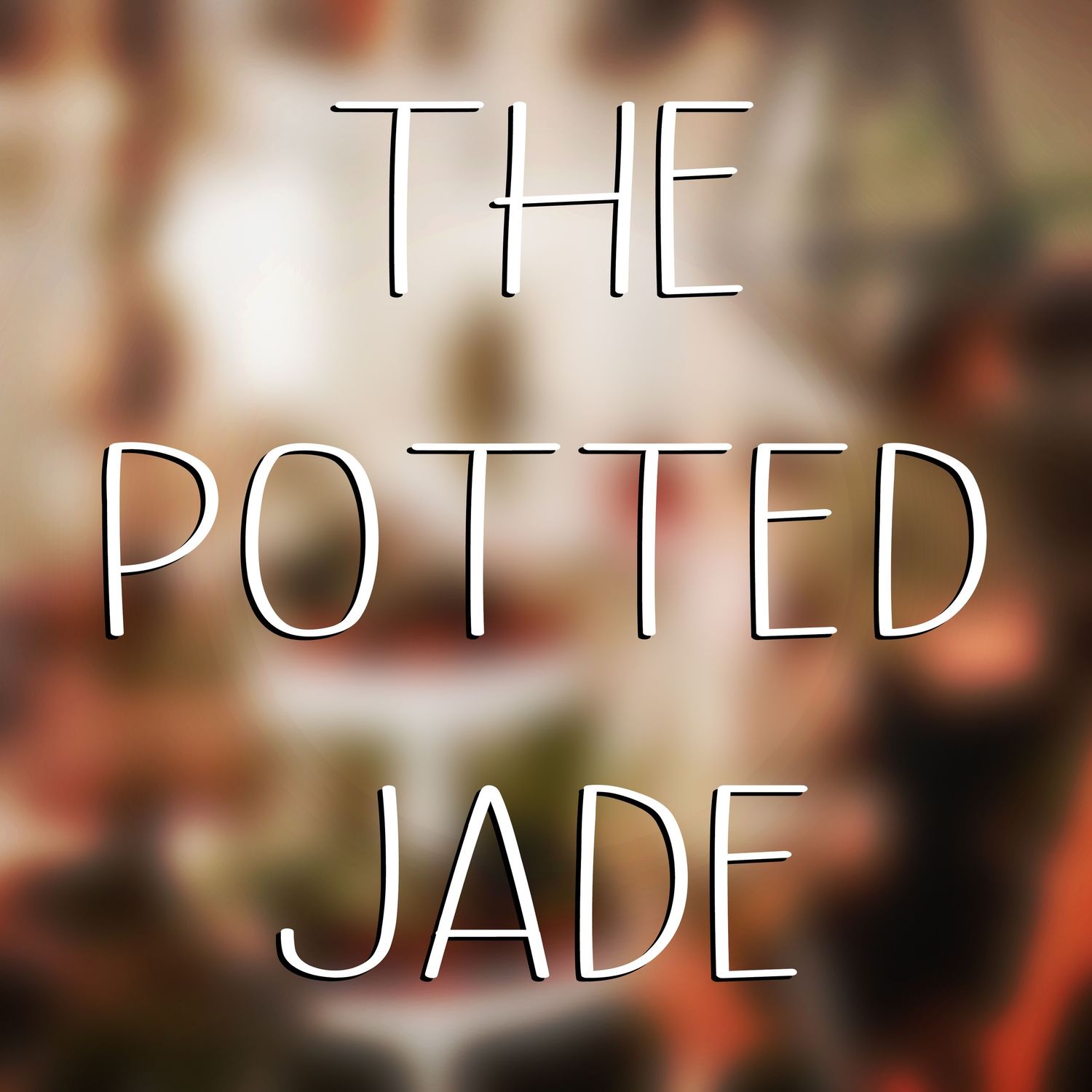 Stylized text reading 'THE JADE' in white elegant lettering against a soft blurred background.