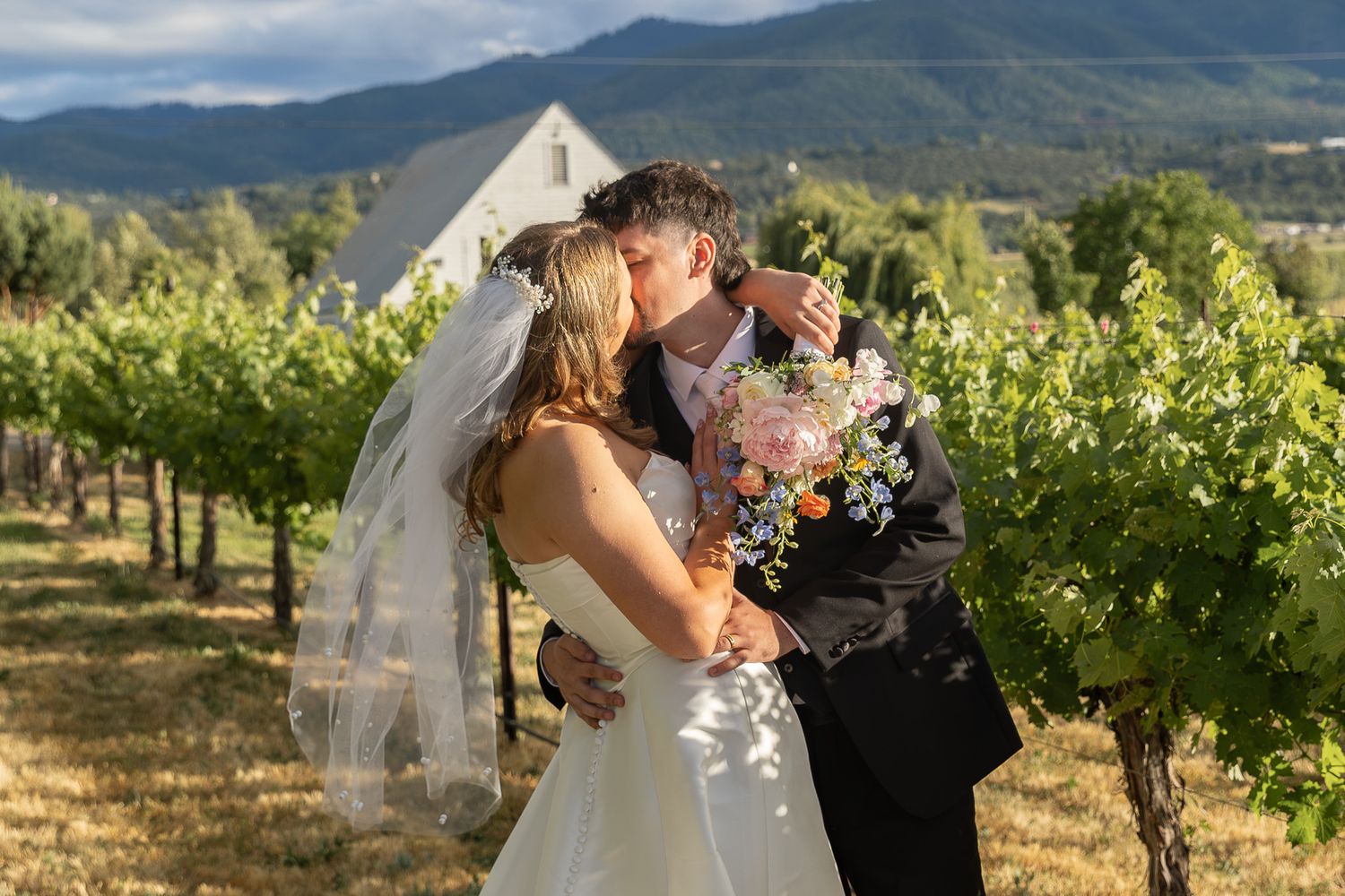 Bride and groom at the alter during their ceremony at Ogren Gardens in Eugene, Oregon, Captured by Oregon wedding photographer.