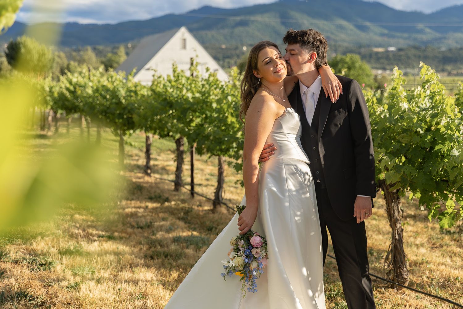 Bride and groom at the alter during their ceremony at Ogren Gardens in Eugene, Oregon, Captured by Oregon wedding photographer.