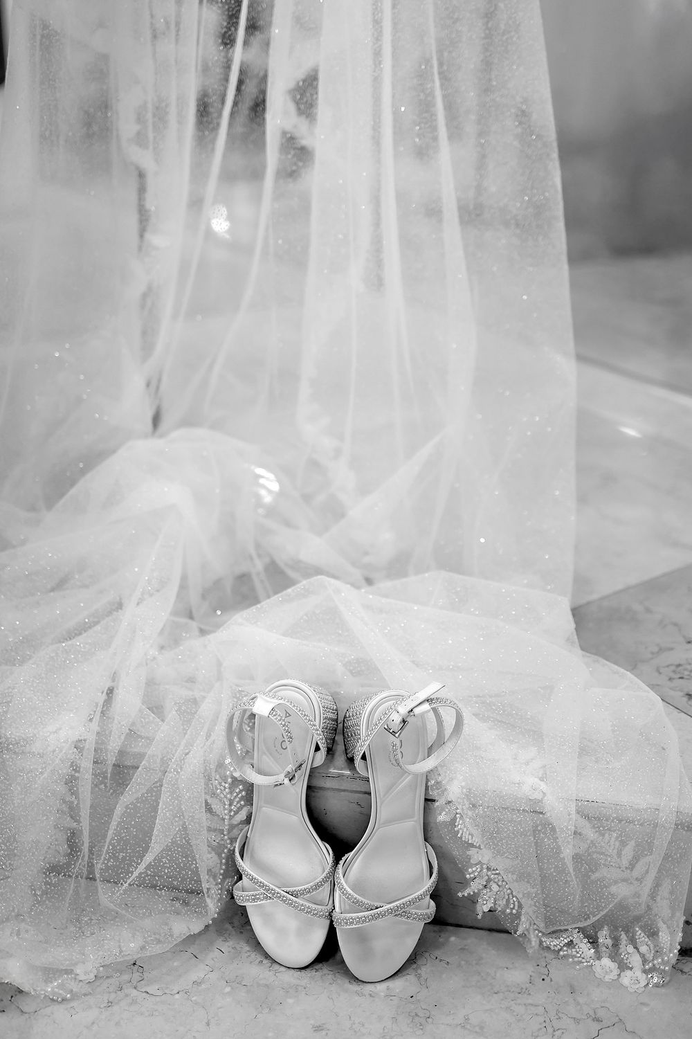 Bride’s shoes under her veil before the ceremony at The Fives Beach Hotel.