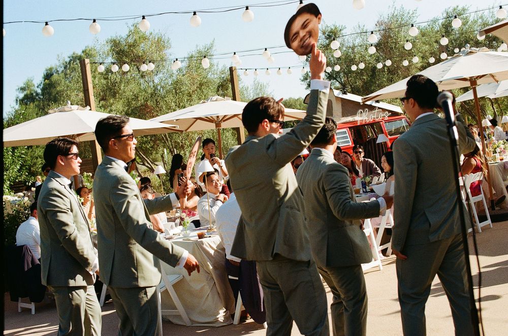 An Orange County film photographer captures the groomsmen being silly and having fun at the wedding reception.