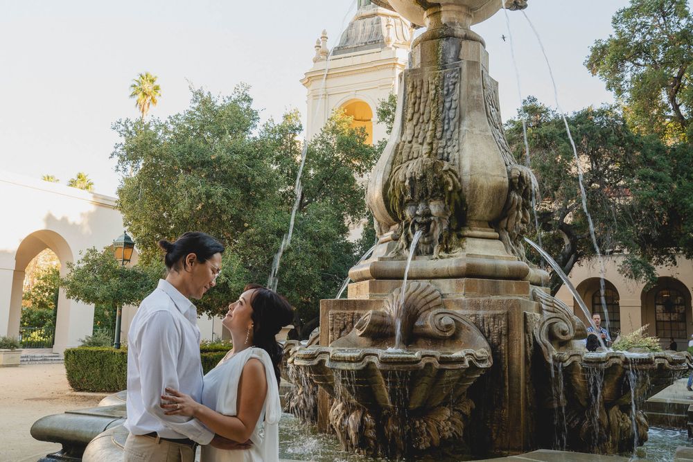 Couple sitting near the fountain at Pasadena City Hall, enjoying quiet conversation.