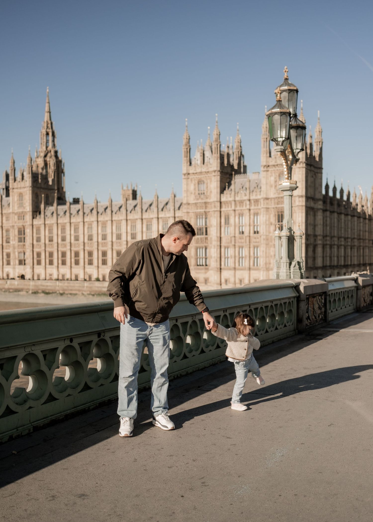 Father and Daughter walking across Embankment, London Family Photoshoot