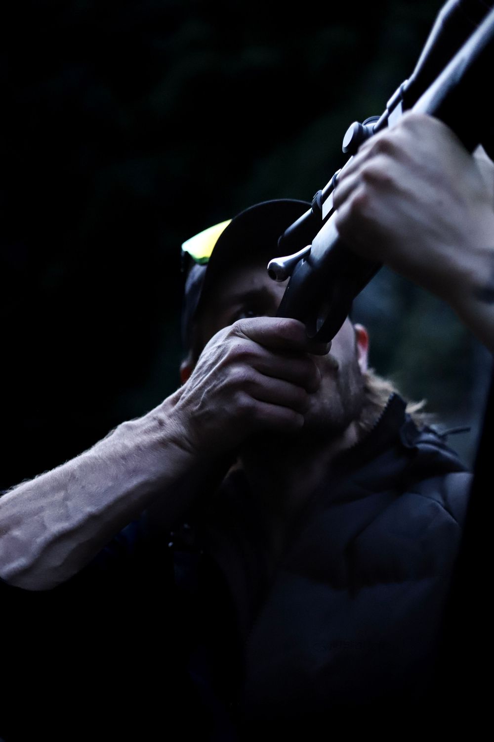 dark-moody-hunting-man-and-his-rifle-whisky-creek.jpg