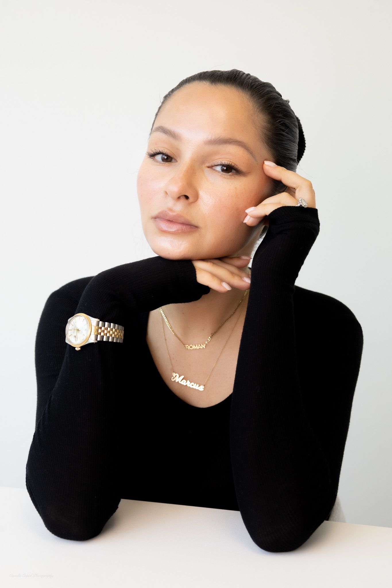 Professional headshot of woman in black blazer on neutral background, corporate and branding photography by Camille Cupid in Pittsburgh