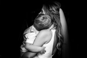 Intimate black and white photos showing tender embraces and emotional moments.