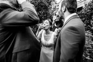 Artistic black and white candid moments from an outdoor wedding celebration.
