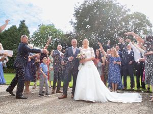 Wedding celebration sequence showing guests throwing confetti at outdoor ceremony.