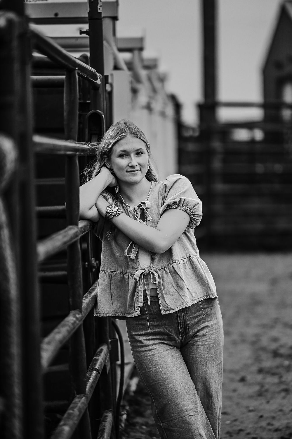 Black and white photo series of someone in casual attire leaning against metal railings in a rustic outdoor setting.