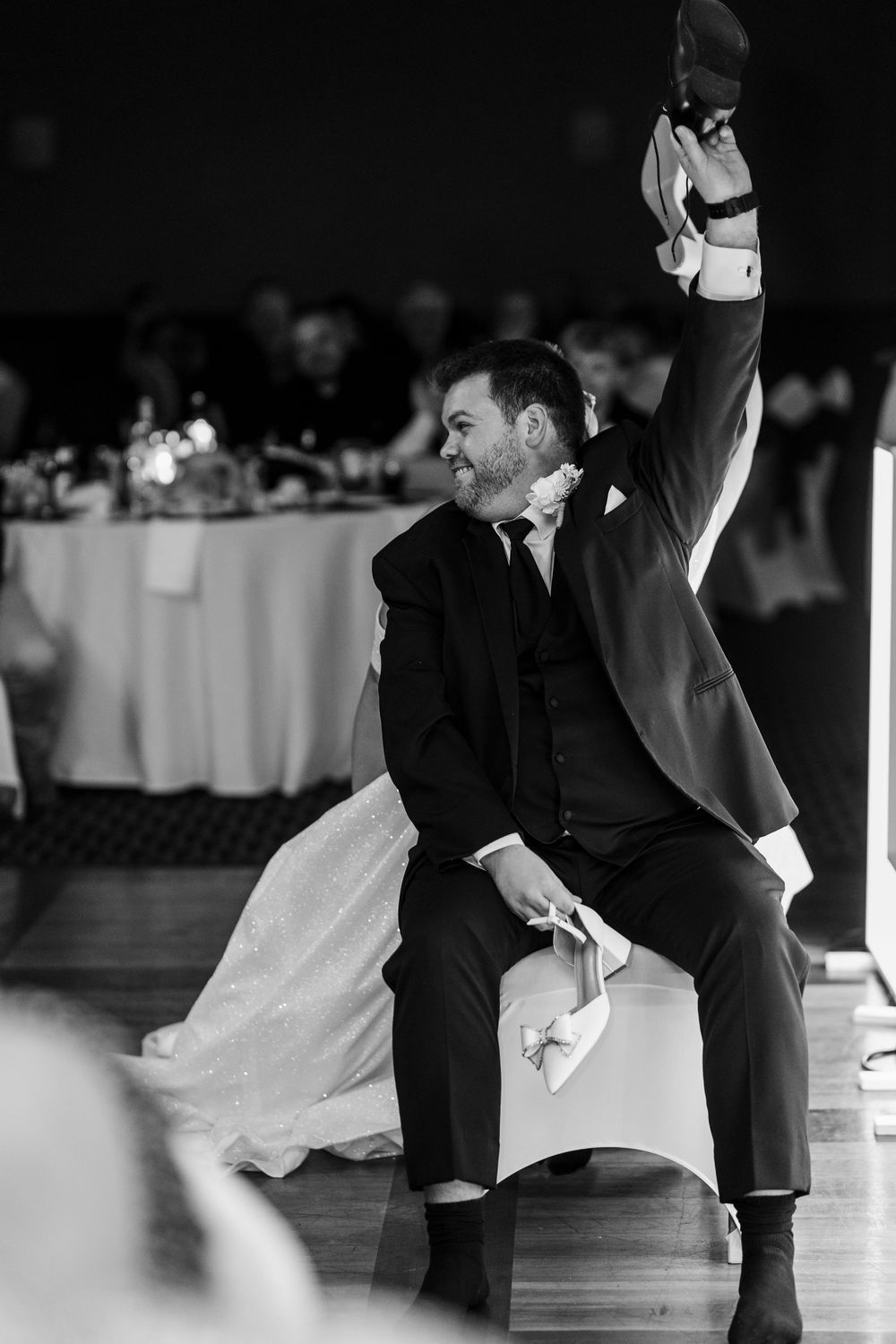 Black and white photos show a couple dancing together at a wedding reception on a wooden floor.