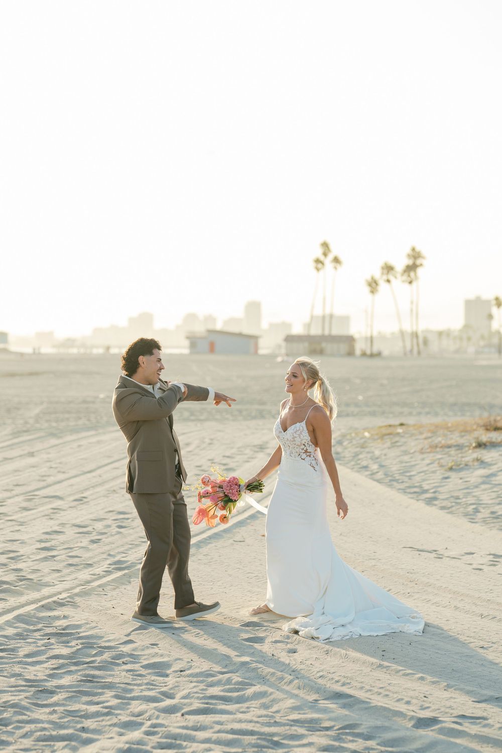 Romantic beach wedding photography session at sunset with sandy shores and soft lighting.