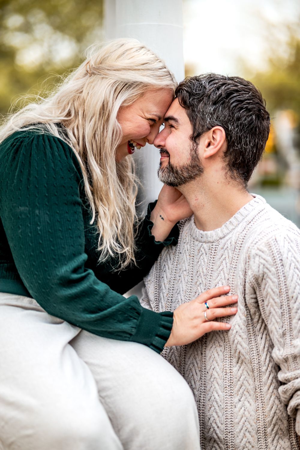 A couple shares intimate moments in a series of close-up shots while wearing cozy winter sweaters.