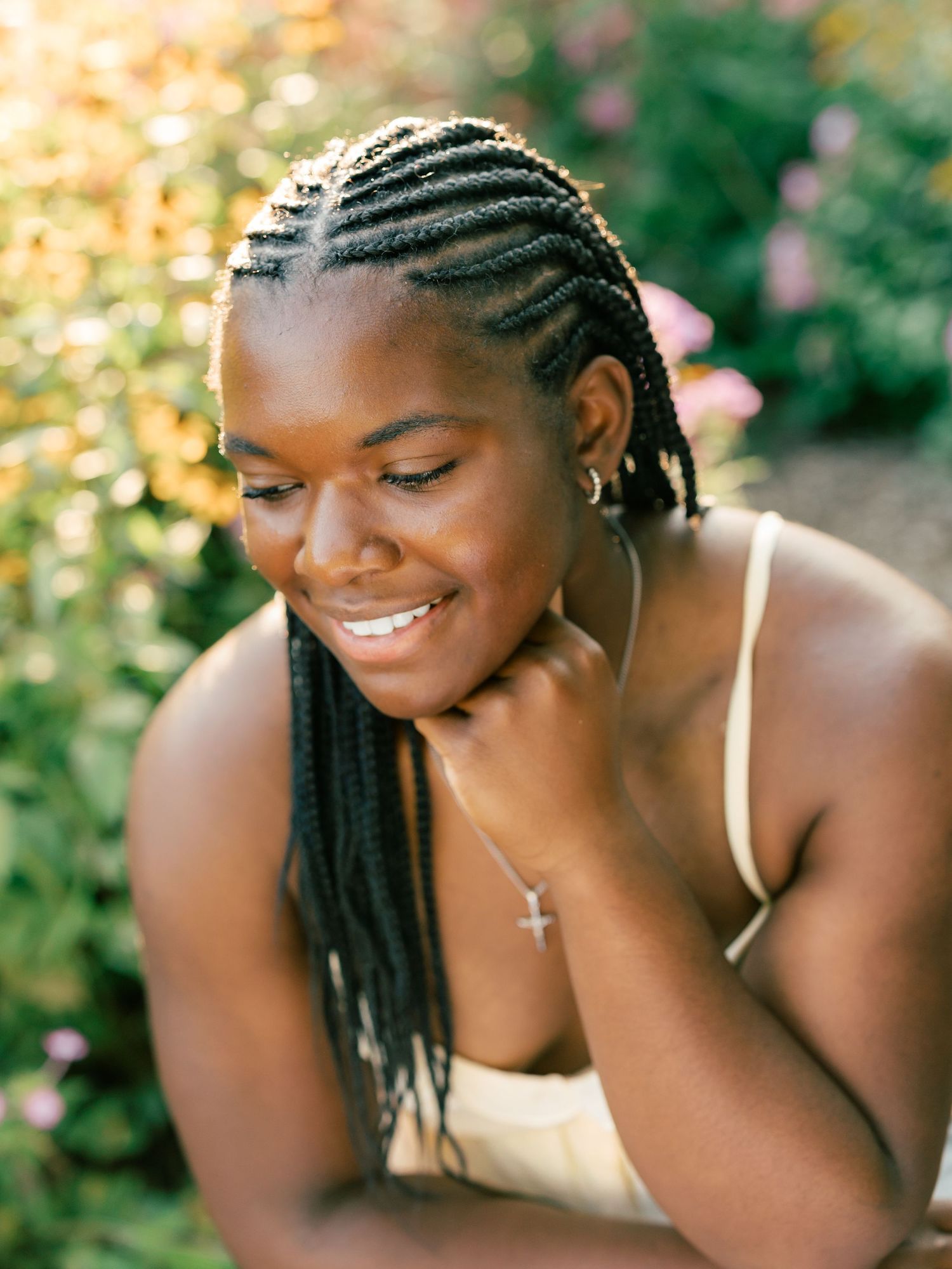 A portrait series in a garden setting showing natural expressions and closeup shots in warm sunlight.