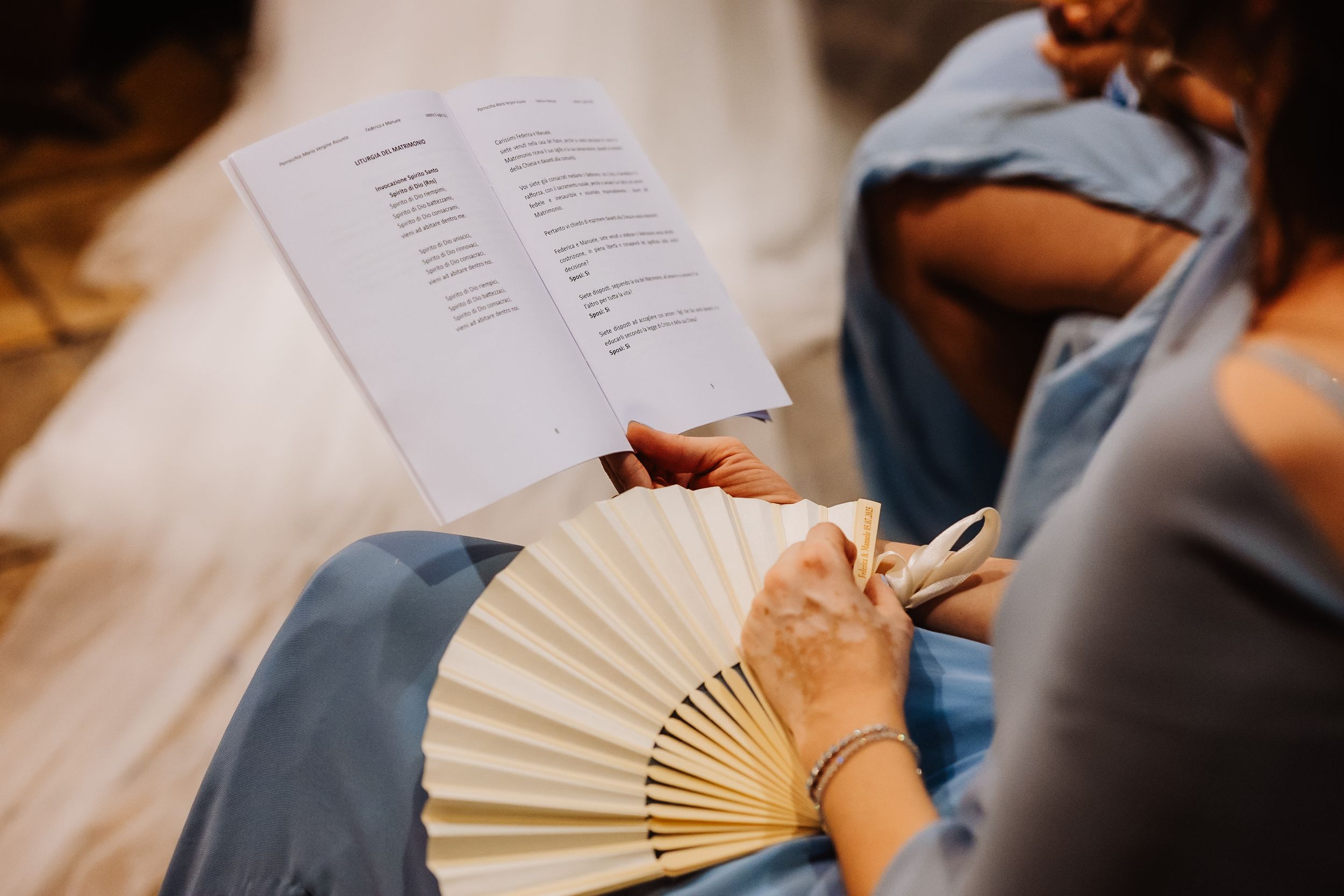 Students reading books and taking notes in a close-up educational setting with papers and documents spread out.