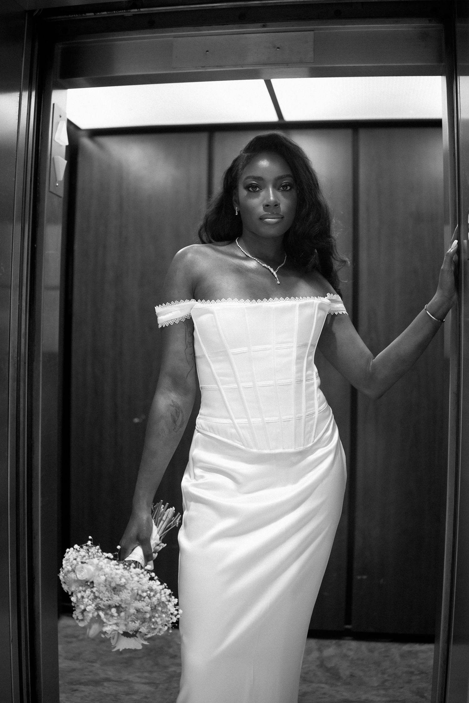 Side by side images show a bride in an elegant white wedding dress holding a bouquet in different elevator poses.