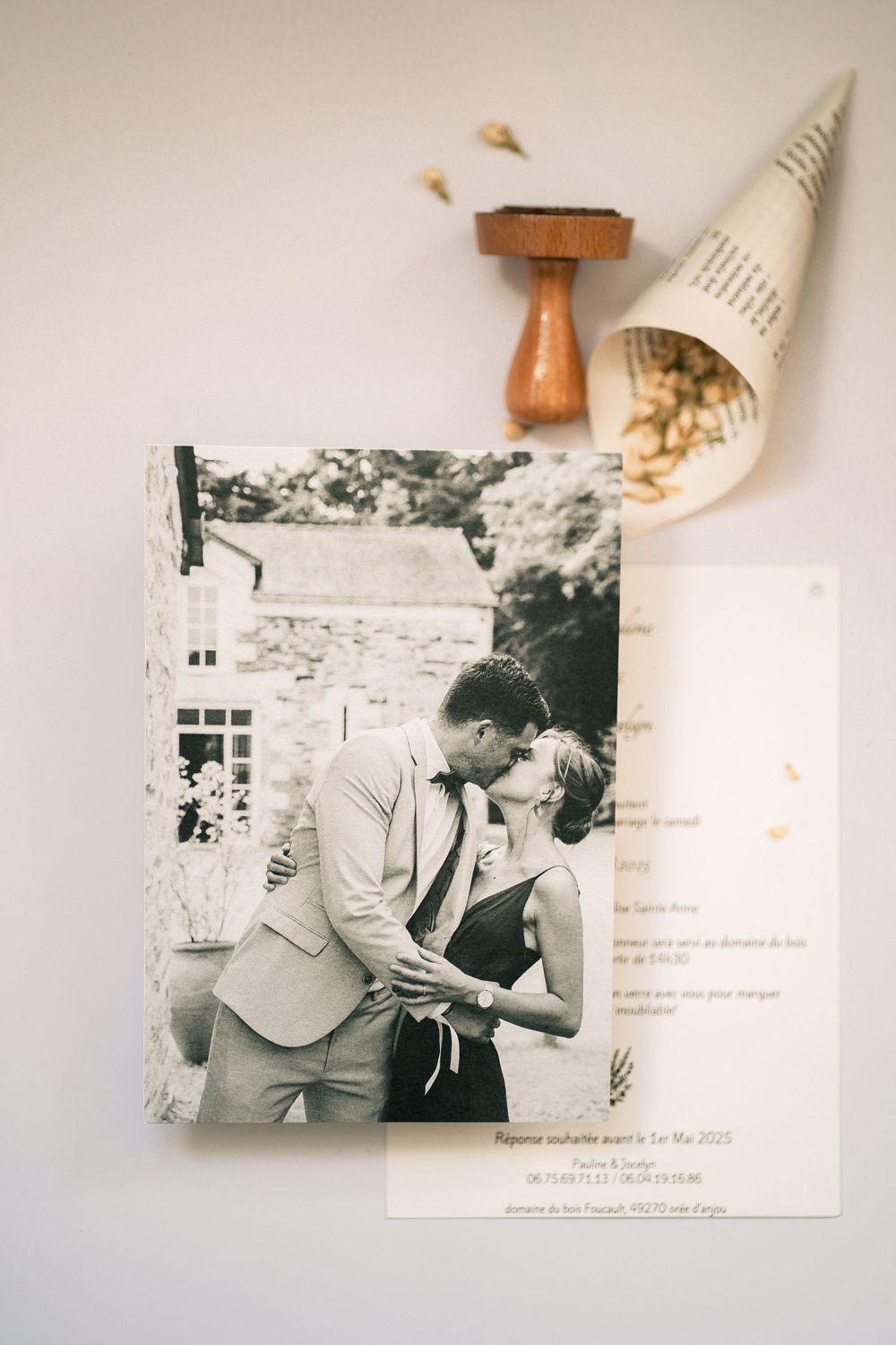 Black and white vintage photograph of a romantic couple displayed with paper decor.
