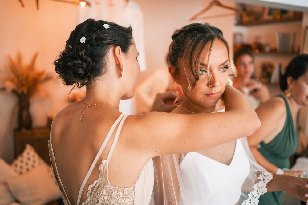 Wedding guests gathered at tables during reception celebration.