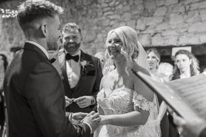Black and white candid photos capturing relaxed moments at a wedding celebration.