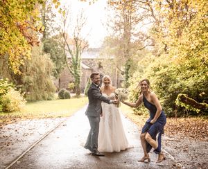 Panoramic sequence of wedding party photos taken in a beautiful fall setting with golden leaves.