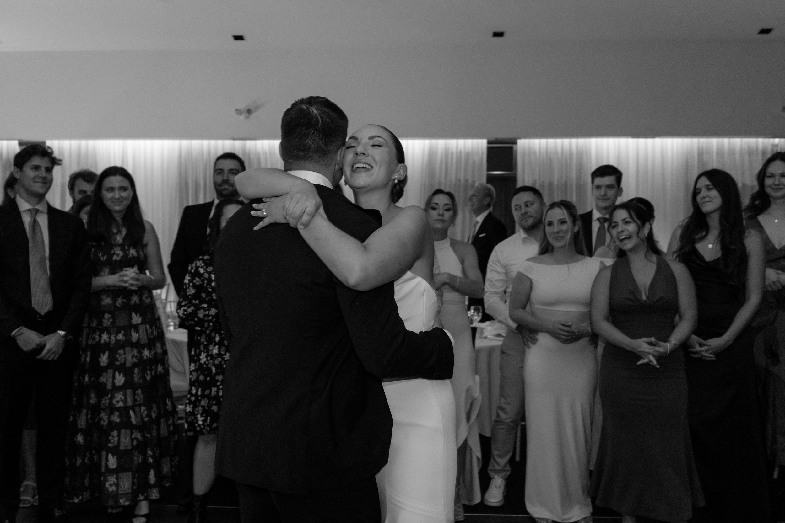 A series of black and white photos showing couples dancing together at what appears to be a wedding reception.