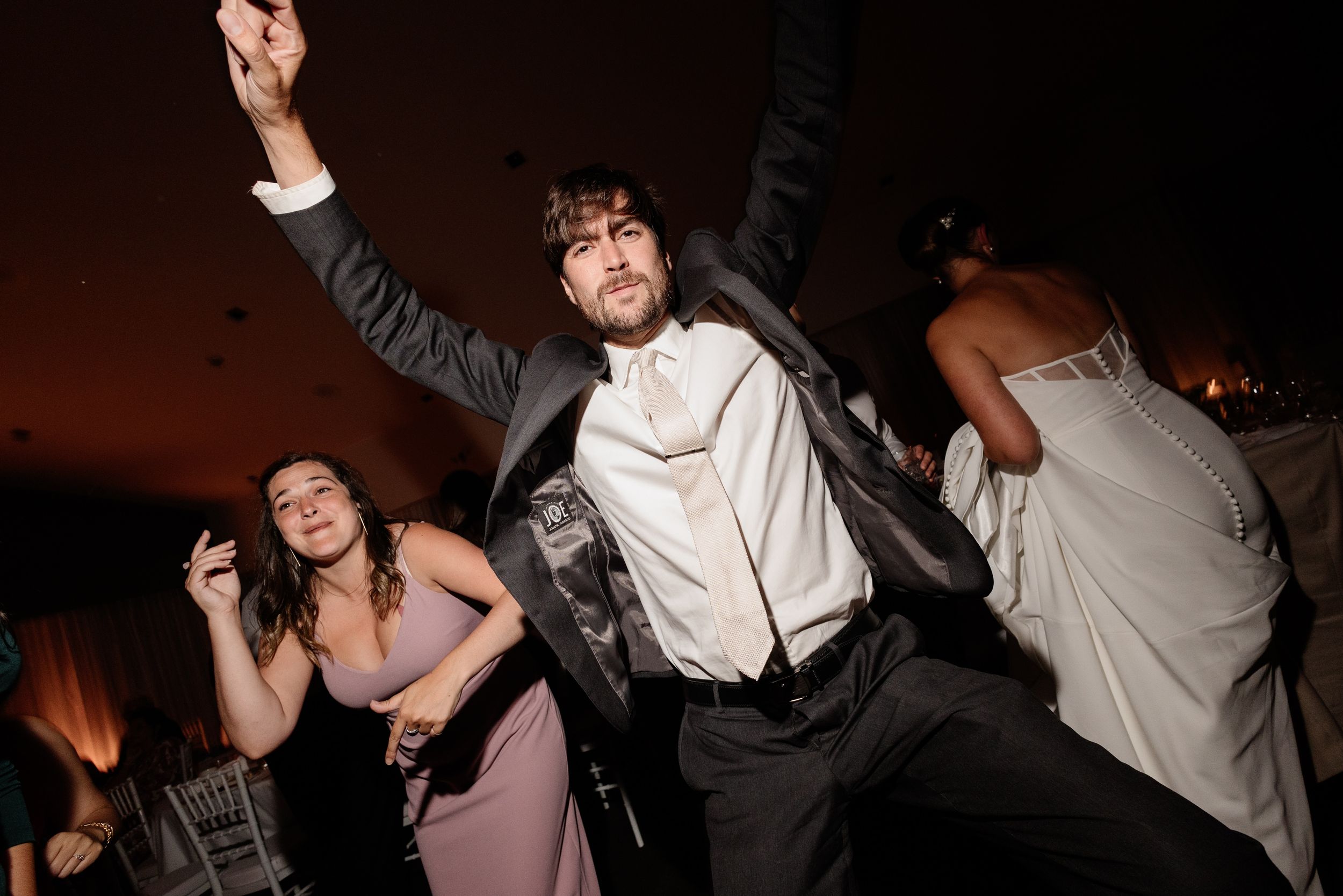 High-energy candid wedding reception. Documentary style dance floor photos captured by a Montreal wedding photographer who matches the party