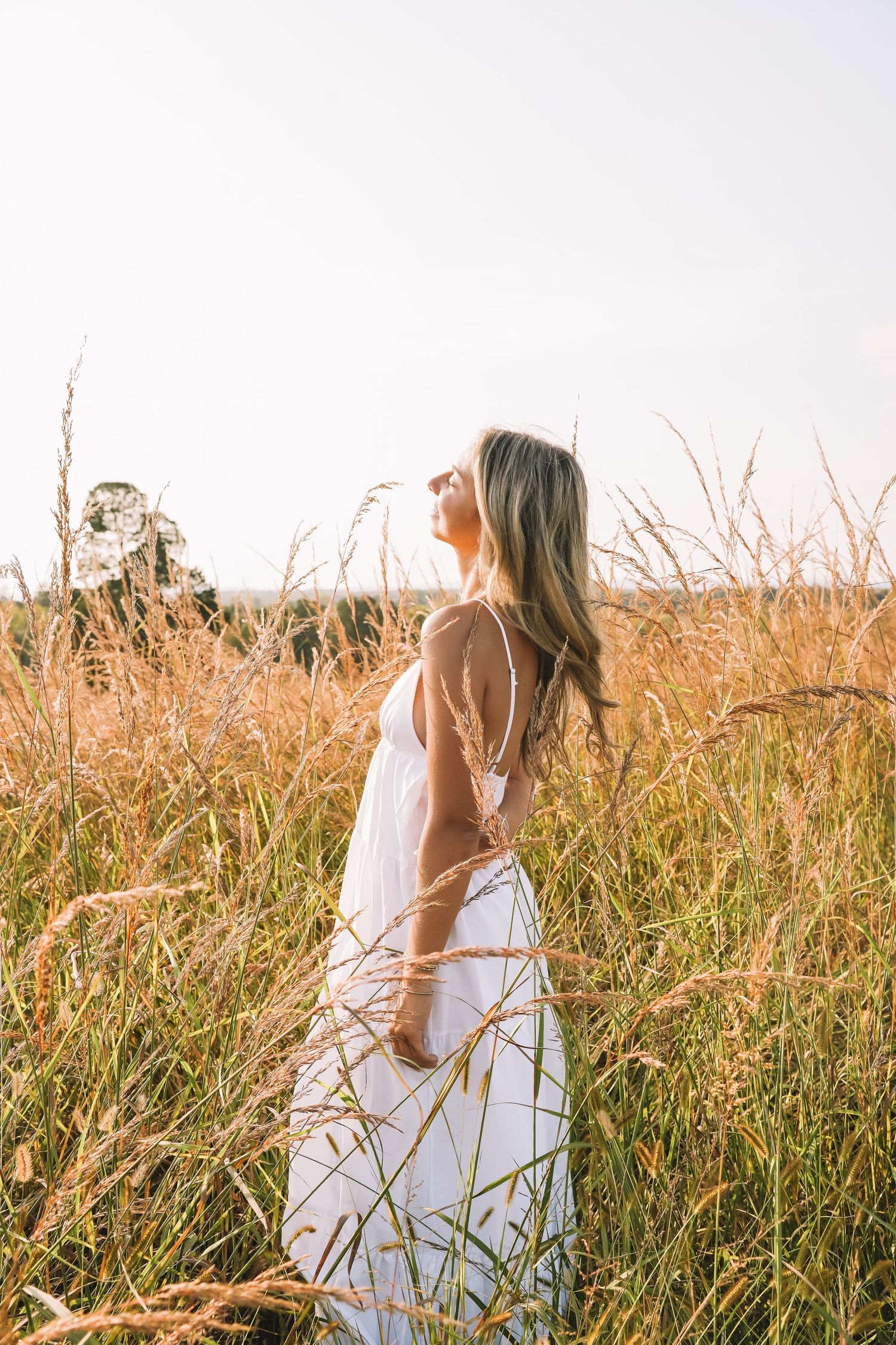 Graduation portrait session in the Manassas, Virginia - beautiful tall grass field | Senior photos by Alina Phillips Photography.