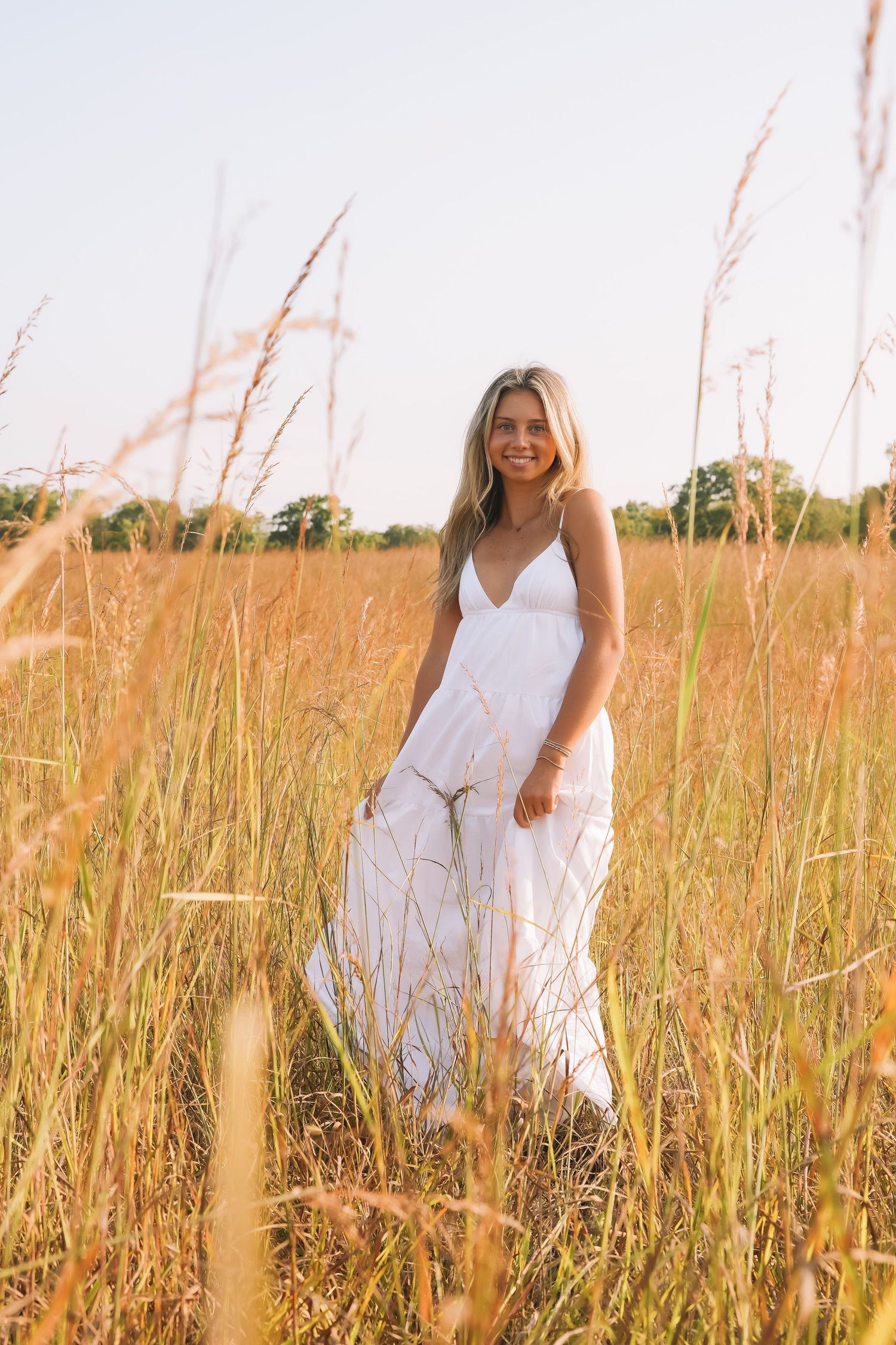 Graduation portrait session in the Manassas, Virginia - beautiful tall grass field | Senior photos by Alina Phillips Photography.