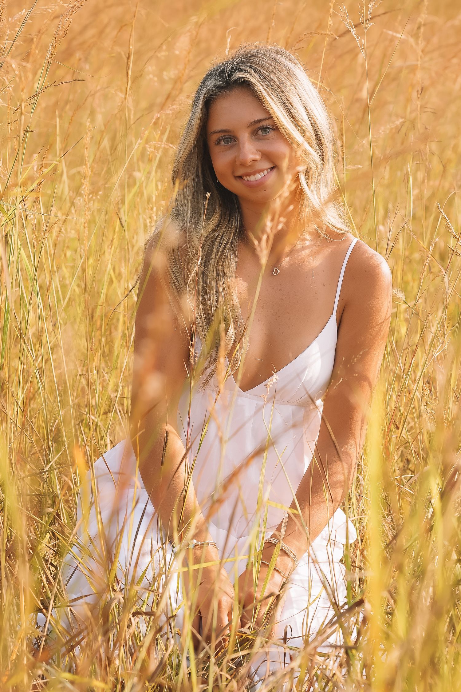 Graduation portrait session in the Manassas, Virginia - beautiful tall grass field | Senior photos by Alina Phillips Photography.