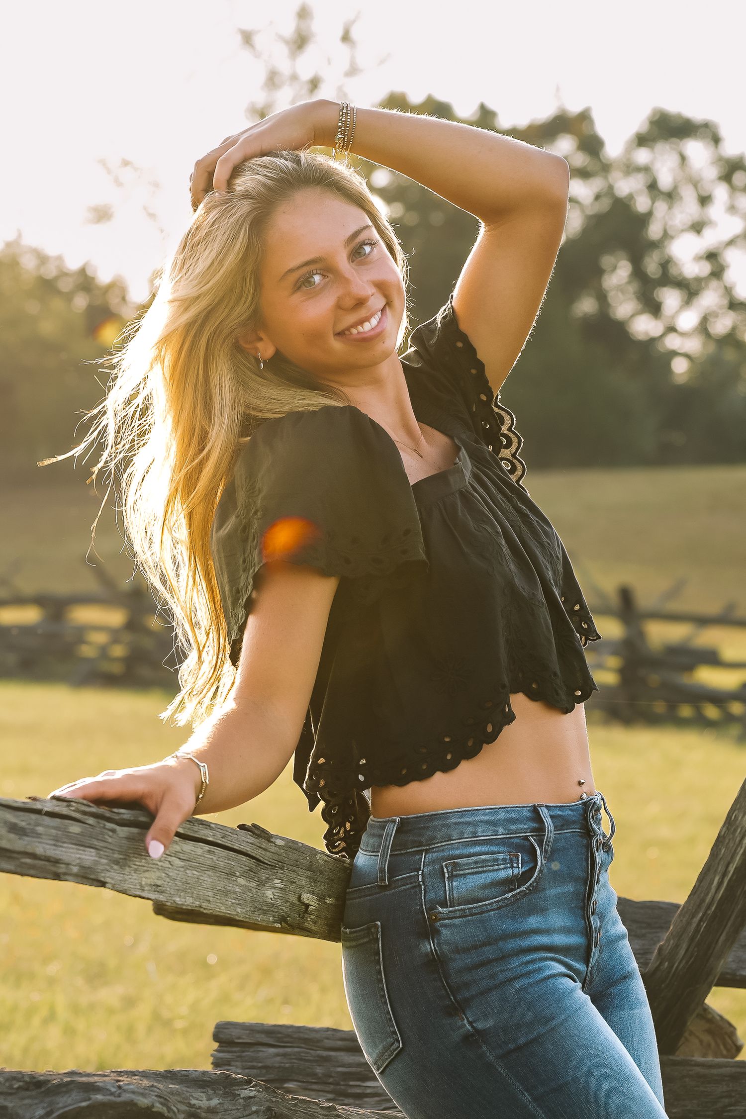 Graduation portrait session in the Manassas, Virginia - beautiful tall grass field | Senior photos by Alina Phillips Photography.