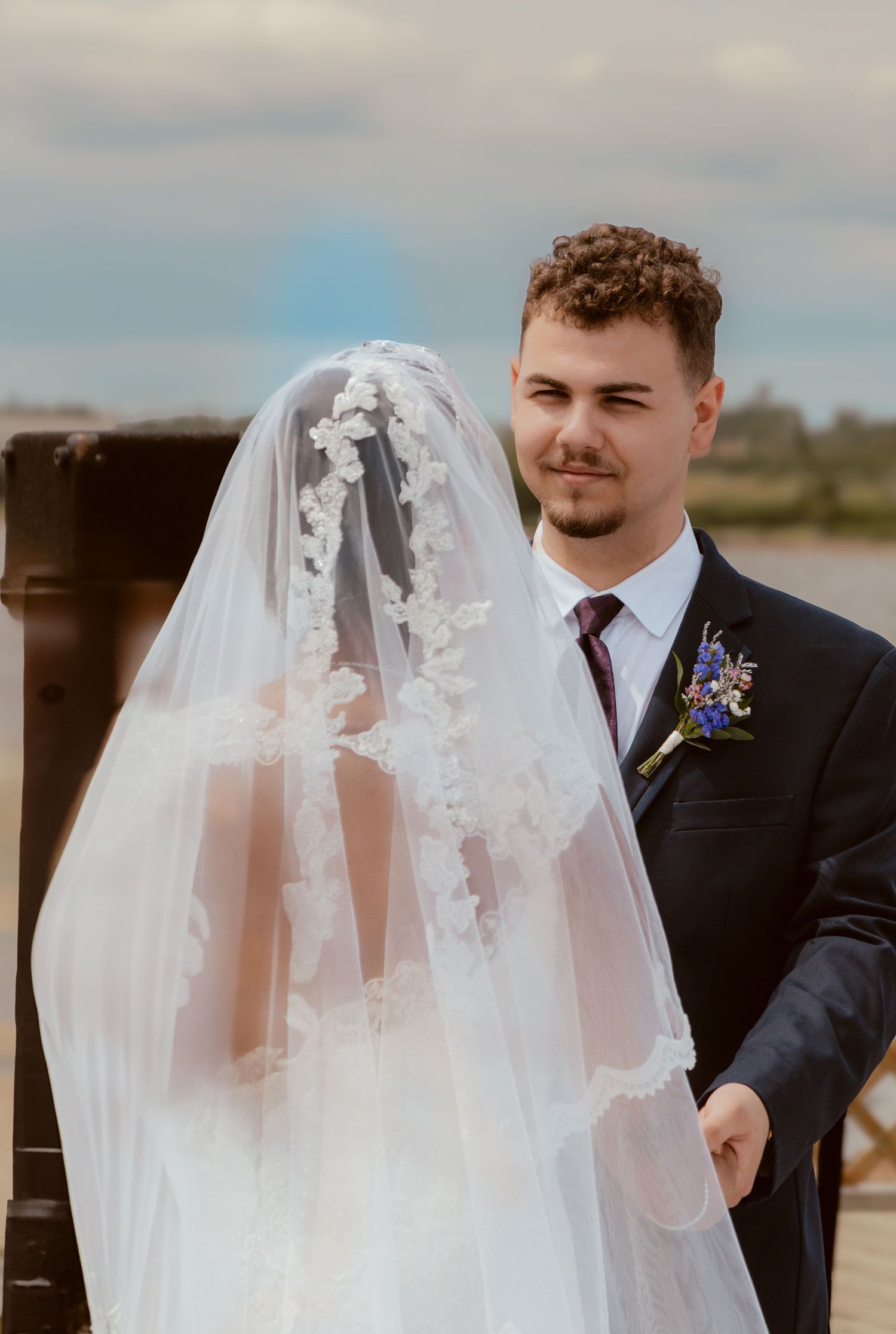 Couple sharing intimate moment during outdoor wedding ceremony.