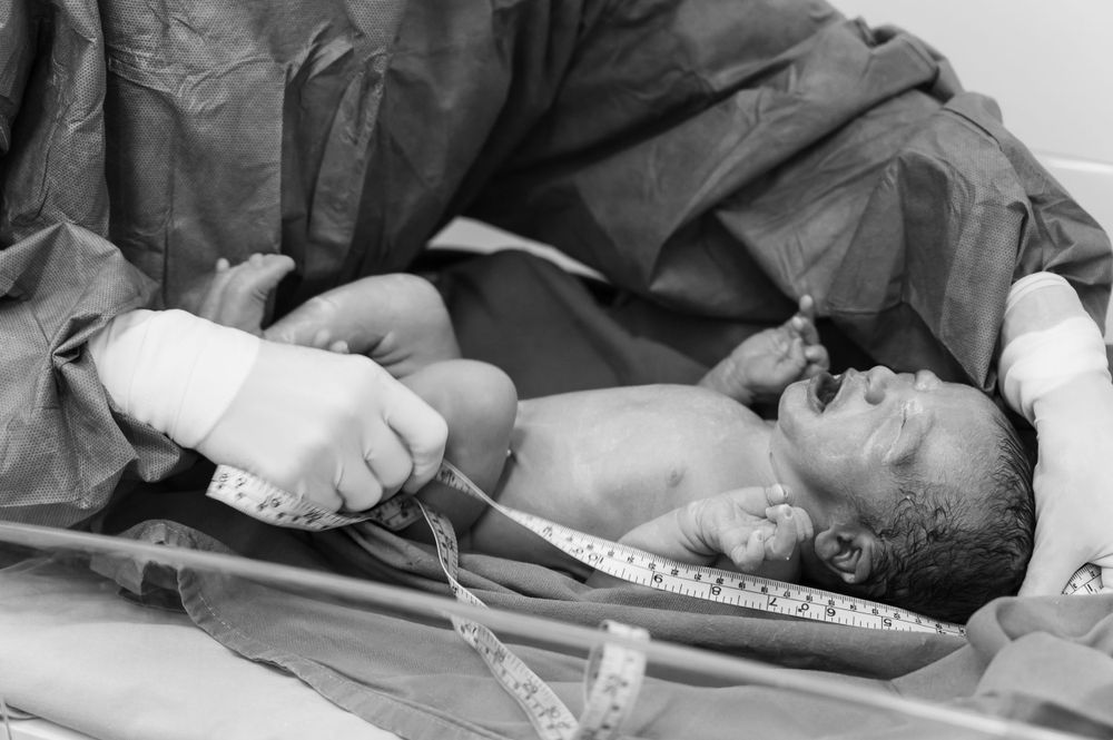 Surgical team conducting a medical procedure in an operating room setting.